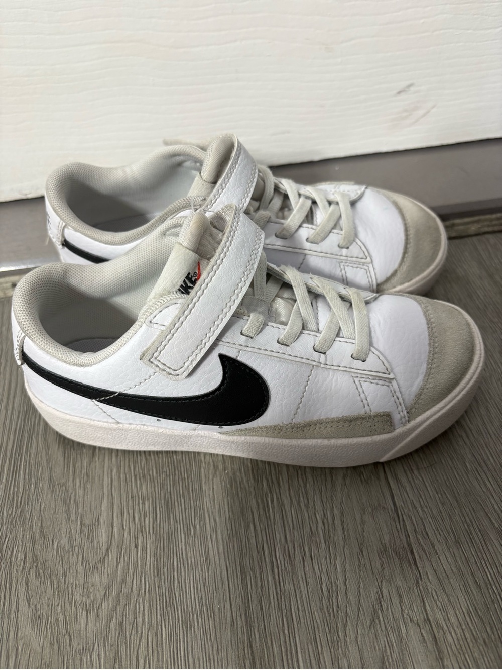 Nike Kids White Sneakers with Black Swoosh